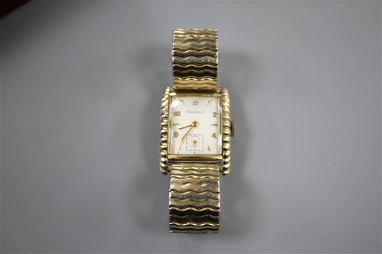 A gentlemans 1950s 10k gold filled Bulova Westover clam shell cased manual wind wrist watch.